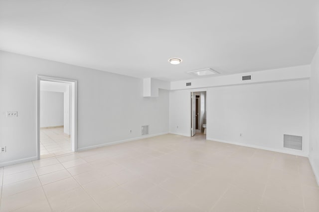 unfurnished room with light tile patterned floors