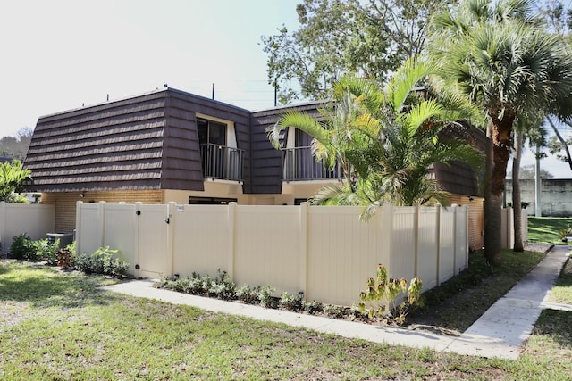 view of home's exterior with a lawn