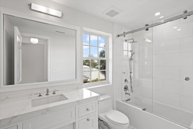 full bathroom with vanity, toilet, and bath / shower combo with glass door