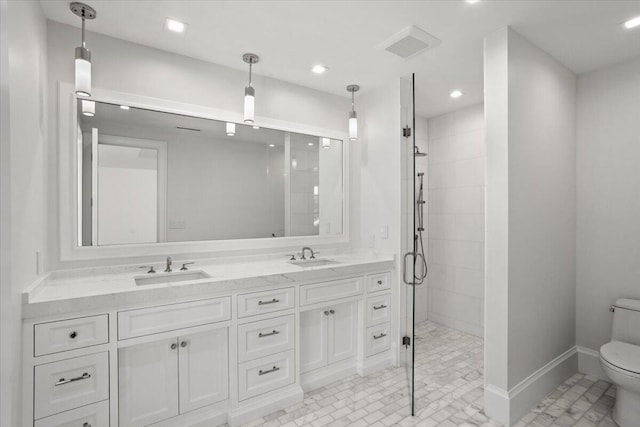 bathroom with tile patterned flooring, vanity, toilet, and a shower with door