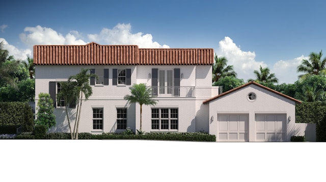 view of front of home with french doors, a balcony, and a garage