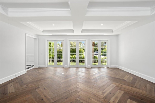 empty room with dark parquet flooring, crown molding, french doors, and a healthy amount of sunlight