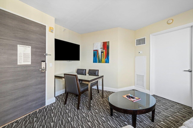 home office with dark colored carpet