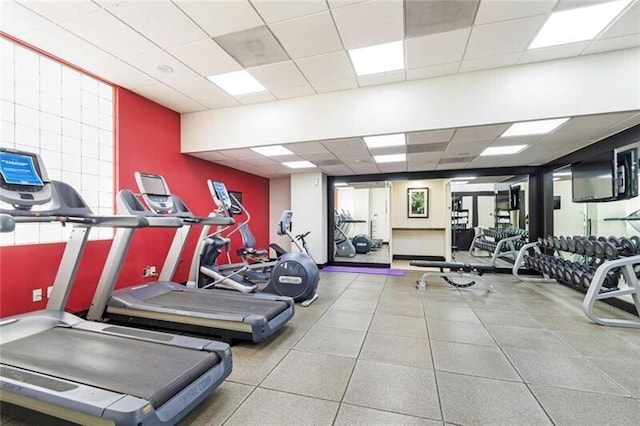 exercise room featuring a paneled ceiling