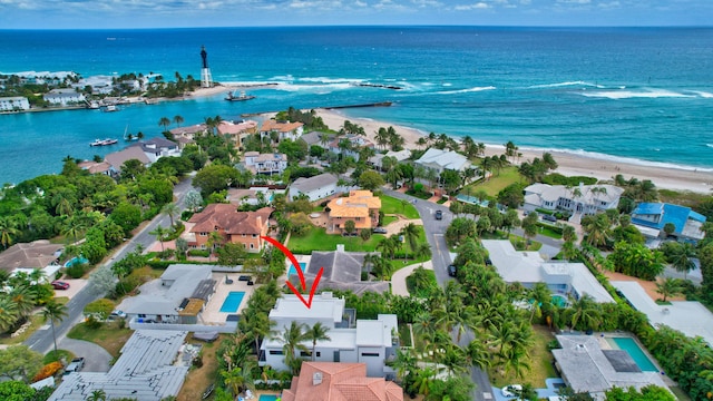 aerial view featuring a beach view and a water view