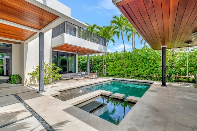 view of pool with outdoor lounge area and a patio area