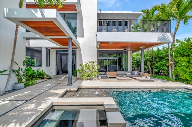 view of pool featuring a patio and ceiling fan