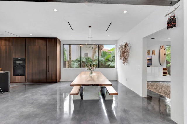 dining room featuring an inviting chandelier and a healthy amount of sunlight