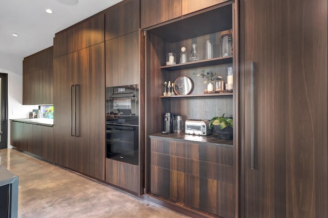 kitchen with dark brown cabinetry