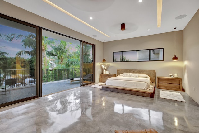 bedroom with concrete flooring and access to outside