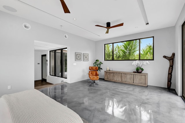 bedroom with concrete floors and ceiling fan