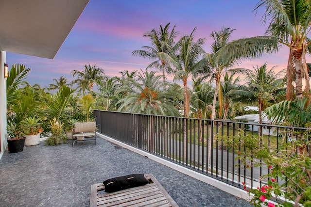 patio terrace at dusk with a balcony