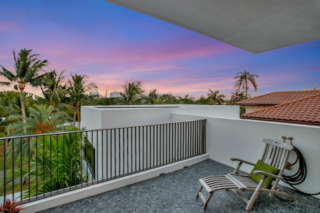 view of balcony at dusk