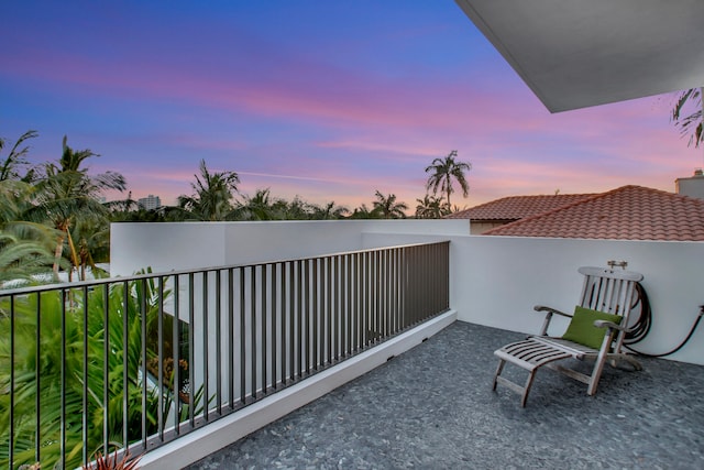 view of balcony at dusk