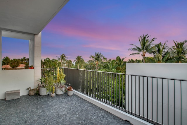 view of balcony at dusk