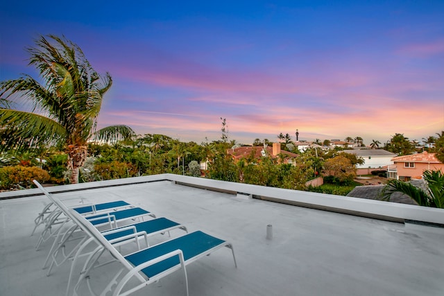 view of pool at dusk