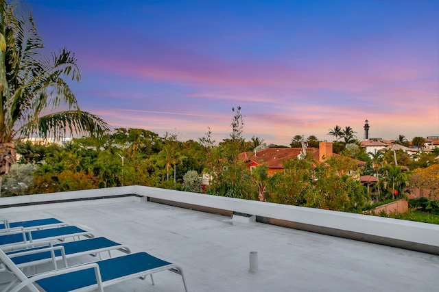 view of patio terrace at dusk