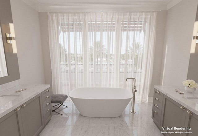 bathroom with ornamental molding, vanity, and a tub