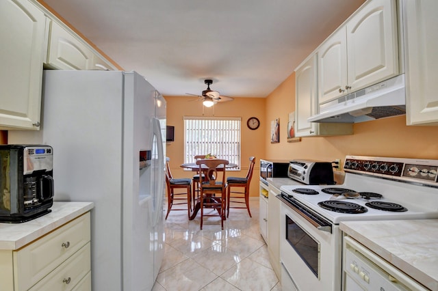 kitchen with white appliances and ceiling fan