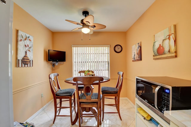 dining room featuring light tile patterned flooring and ceiling fan