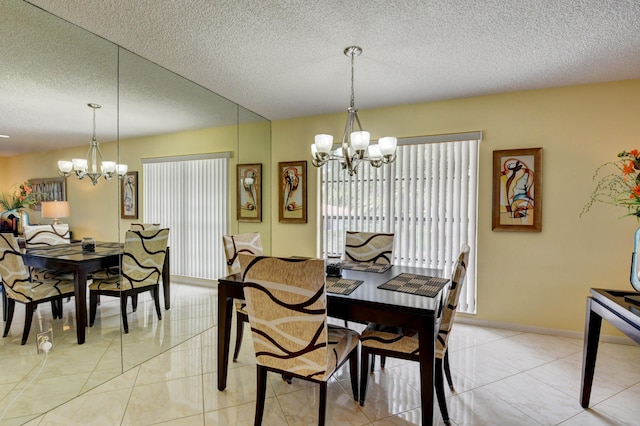 dining space featuring a textured ceiling, a notable chandelier, and light tile patterned floors