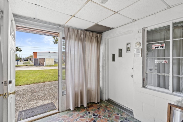 interior space featuring a drop ceiling