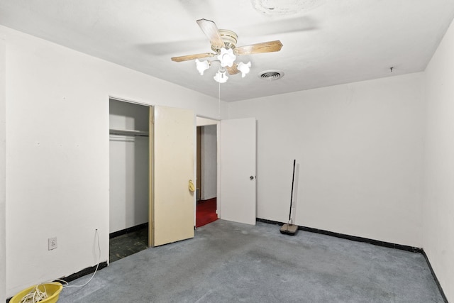 unfurnished bedroom with a closet, ceiling fan, and dark carpet