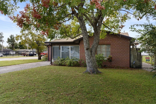 view of side of property featuring a yard