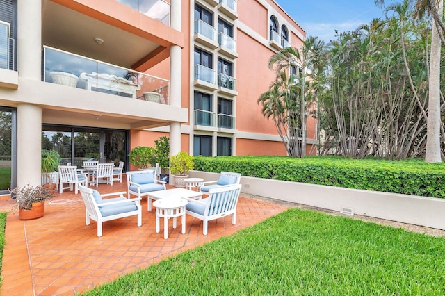 exterior space featuring a balcony and a patio area