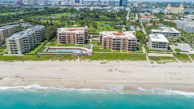 bird's eye view featuring a water view and a view of the beach