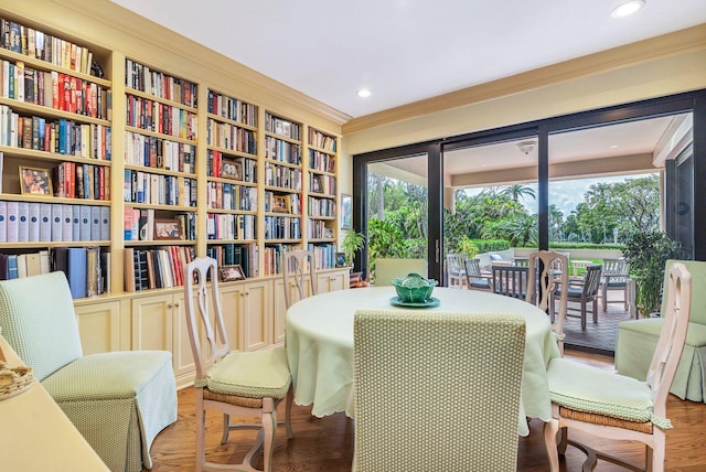 interior space featuring built in features, dark hardwood / wood-style floors, and crown molding