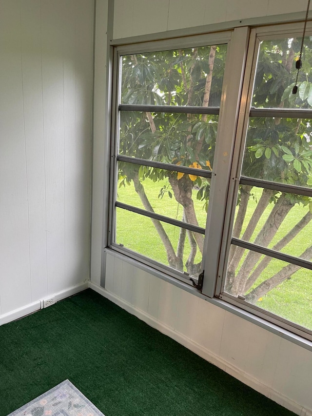 carpeted spare room featuring a healthy amount of sunlight