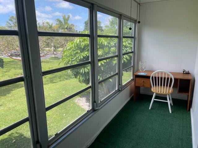 sunroom / solarium featuring a healthy amount of sunlight