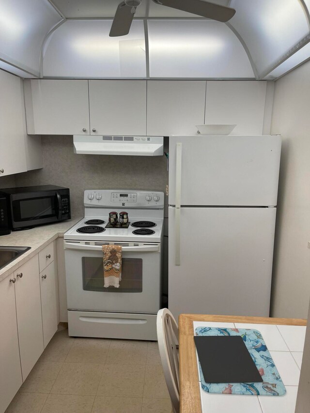 kitchen with light tile flooring, ceiling fan, white appliances, and white cabinetry