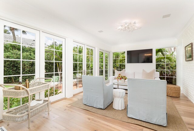 236 Pendleton Ave, Palm Beach, FL 33480 - sunroom featuring wood finished floors, french doors, and brick wall