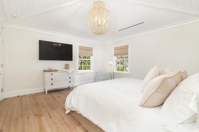 236 Pendleton Ave, Palm Beach, FL 33480 - bedroom with a chandelier, light wood finished floors, baseboards, and beamed ceiling