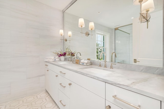 bathroom with vanity with extensive cabinet space and dual sinks