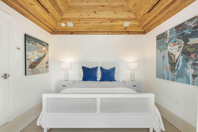 bedroom featuring wooden ceiling and carpet flooring