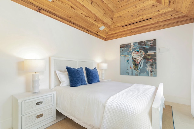 carpeted bedroom featuring vaulted ceiling and wood ceiling