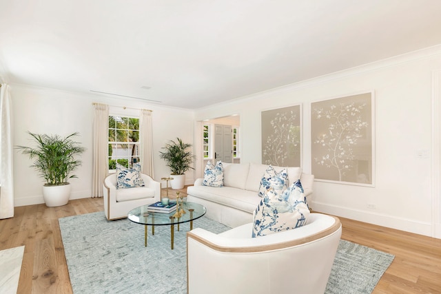 living room with crown molding and light wood-type flooring