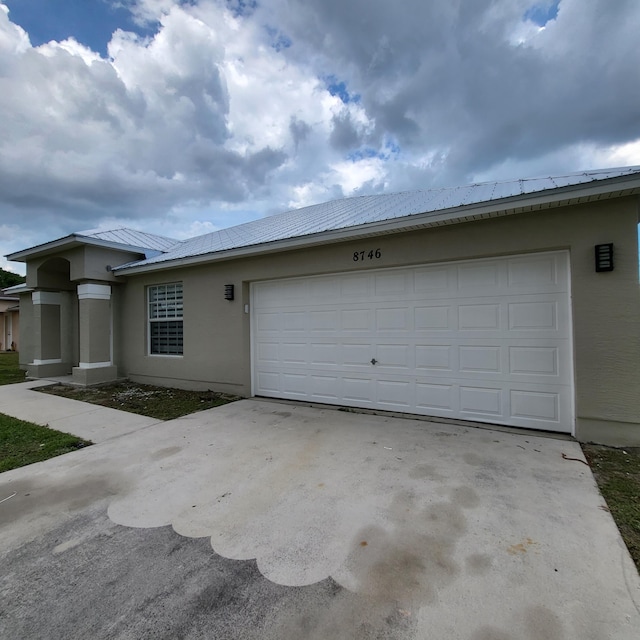 view of side of home with a garage