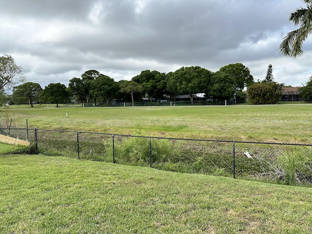 view of yard with a rural view