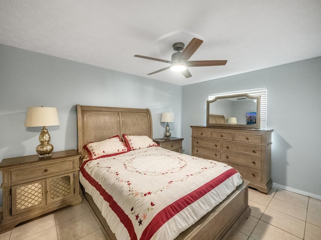 tiled bedroom featuring ceiling fan