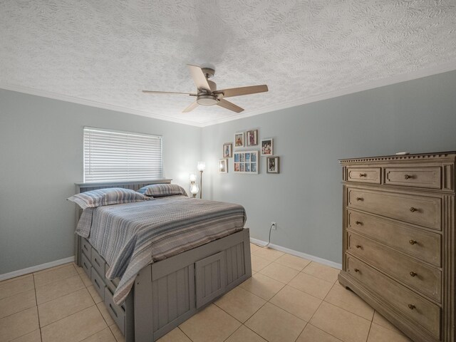 bedroom with light tile flooring, ceiling fan, and a textured ceiling