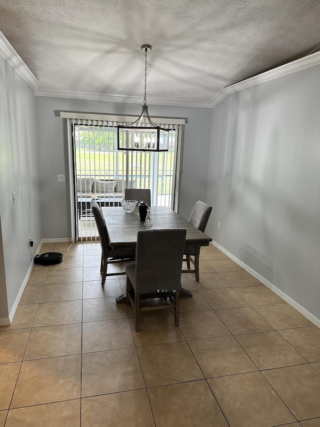 tiled dining area featuring a notable chandelier, a textured ceiling, and crown molding