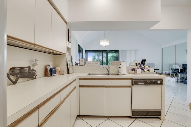 kitchen with kitchen peninsula, white dishwasher, a chandelier, and sink