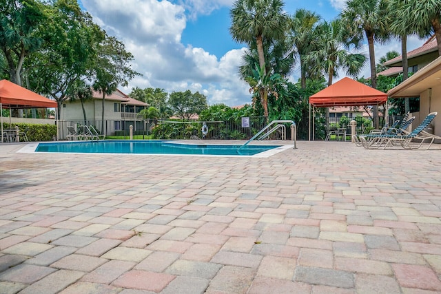 view of pool featuring a gazebo and a patio