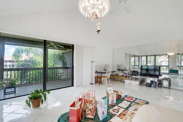 tiled living room with high vaulted ceiling and ceiling fan with notable chandelier