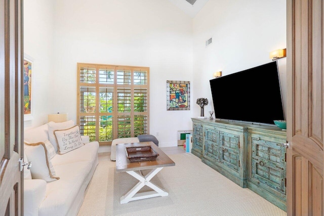 living room with a high ceiling