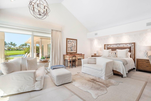 tiled bedroom featuring an inviting chandelier, high vaulted ceiling, and access to exterior